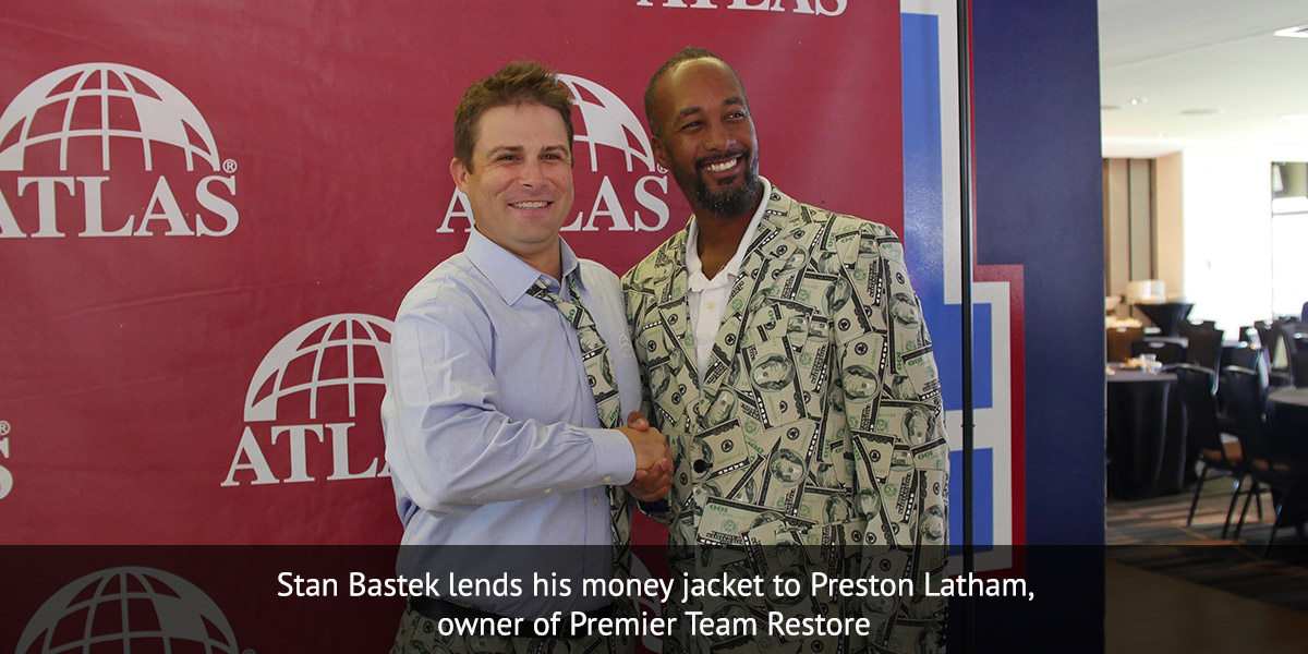 Stan Bastek lends his money jacket to Preston Latham, owner of Premier Team Restore